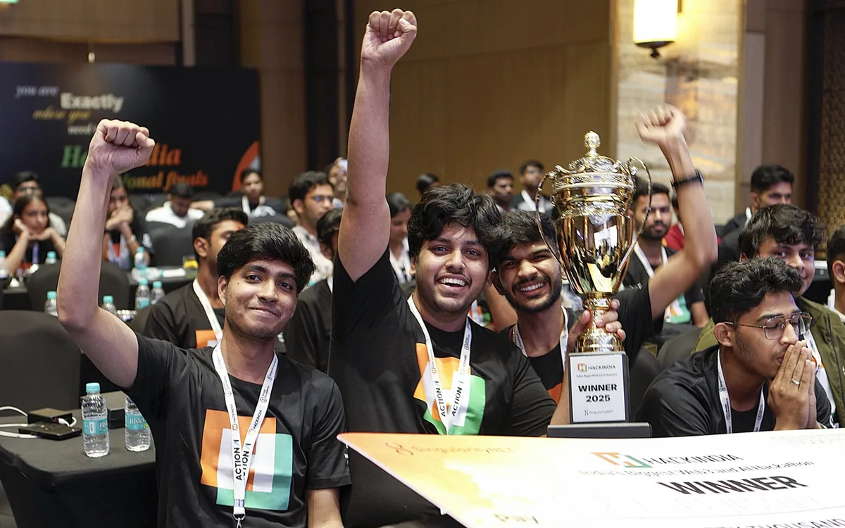 HackIndia national finals, a winning team celebrating with the trophy